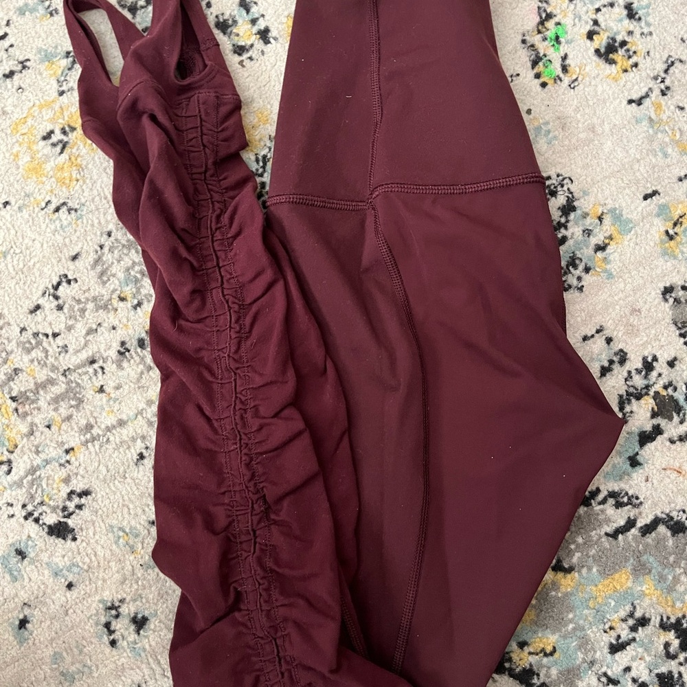 Two Lululemon Athletica Burgundy and black/ dark gray leggings